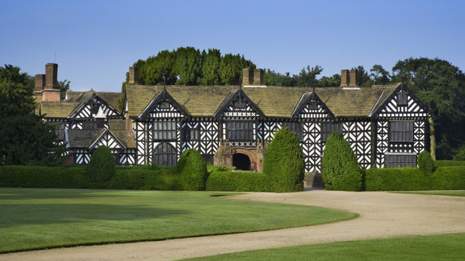 The timber-frame exterior of Speke Hall, Liverpool on a sunny day